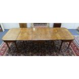 A 19th century oak extending Dining Table, with rosewood crossbanding and ebony stringing, the