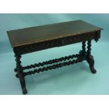 A Victorian carved oak Writing Table, the rectangular top inset with brown tooled leather skiver
