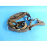 A W.W.1 period brown leather military Sam Browne belt, with sword hanger, together with another