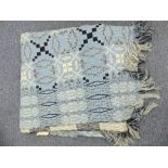 A 20thC good quality reversible woollen Welsh Blanket, geometric patterns in pale blue, black and