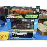 Three 1:18 scale diecast metal model Cars, all boxed, comprising Universal Hobbies MGB GT Police
