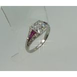 A diamond and ruby Art Deco style Ring, the square front set with four invisibly set Old French