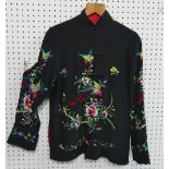 Chinese textiles: an embroidered black/red silk reversible Mandarin Jacket, the black silk