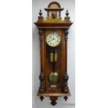 A late Victorian walnut cased Vienna Regulator wall clock, with 8-day two-train movement striking on