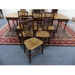 A set of six 19th century style spindle-back Dining Chairs, with rush seats, on turned and block