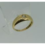 An 18ct yellow gold Ring, gypsy set with a brilliant cut diamond, Size M, total weight 3.9g,