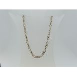 A 9ct yellow gold open link Necklace, formed of Staffordshire knot links alternating with an oval