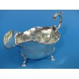 A George V silver Sauce Boat, hallmarked London, 1929, of traditional form with scroll handle, shell