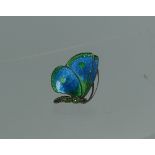 Child & Child; An attractive enamel and jewelled butterfly Brooch, the folded back wings in