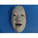 A Meiji period Japanese carved wood Noh mask of Zo-Onna, decorated in coloured pigment over gesso,