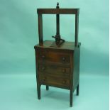 A George III oak Book Press on Chest of Drawers, the rectangular press with turned thread and