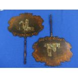 A pair of Vctorian papier-mâché Face Fans or Face Screens, of shaped oval form, decorated with