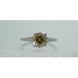 A yellow diamond solitaire Ring, of light yellow / orange tones, the Old Mined Cut stone circa 1½ct,