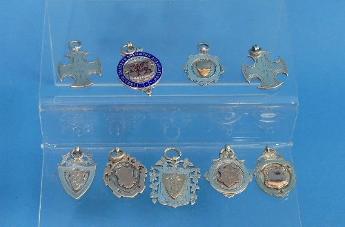 A collection of nine early 20thC silver Watch Fobs, one with enamel decoration, six with gold