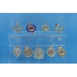 A collection of nine early 20thC silver Watch Fobs, one with enamel decoration, six with gold