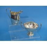 A small George V silver Cream Jug, by S Blanckensee & Son Ltd. with leaf capped handle and beaded