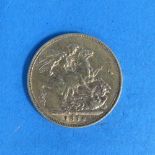 A Victorian gold Sovereign, young head, dated 1874.