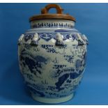 A Pair of Chinese porcelain blue and white Vases, of globular pot form with later wooden covers,