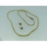 A string of graduated baroque Cultured Pearls, with a 14ct gold box snap marked 585, together with a