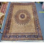 Tribal Rugs; a hand knotted Iranian Kirman style rug, the cream ground with blue central oval medal