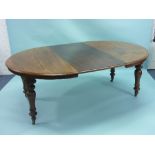A Victorian mahogany D-end extending Dining Table, with one leaf, on ring turned bulbous legs with