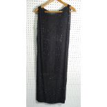 A 1920s black crepe de chine beaded Flapper Dress, with long side vents, approx. size 12.