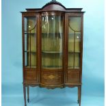 An Edwardian mahogany marquetry inlaid bow-front display cabinet, with box-wood and ebony stringing,
