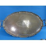 A large Edwardian silver two handled Tray, hallmarked London, 1908, of oval form with a serpentine