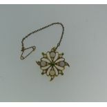 An opal Pendant / Brooch, the openwork flowerhead, set with opals and demantoid garnet points, all