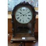 A 19th century mahogany 8-day Mantel Clock, of arched form with 8in (20.25cm) diameter dial signed