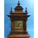 An early 20th century German walnut Mantel Clock, with 8-day movement striking on a gong, the