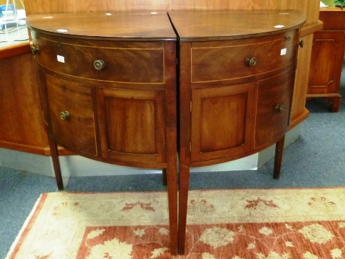 A pair of late-19th/early-20th century bow-front Dining Room Cabinets, with boxwood stringing,