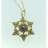 A late Victorian 15ct yellow gold open star shaped Brooch/Pendant, set in the centre with an