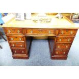 An Edwardian walnut twin pedestal Desk, with rectangular moulded top and inset tooled leather skiver