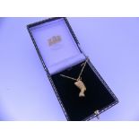 An 18ct yellow gold Pendant, formed as a bust of Nefertiti, unmarked but tested, on an 18ct two-