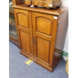 A Victorian mahogany two door Cupboard by Sopwith & Co, Newcastle on Tyne, each door with arched