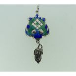 An Art Nouveau silver and enamel Pendant, with a pierced diamond shaped centre, silver drop below,