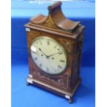 W. H. Bagnall, London: a Regency rosewood pagoda top Bracket Clock with brass inlays, circular