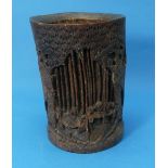 A 19thC Chinese Bamboo Brushpot, the front carved with scholars in a bamboo forest, some losses