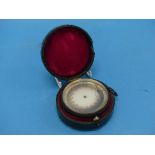 A 19th century French gilt brass aneroid pocket barometer, the silvered dial signed Chevalier, 21