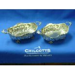 A pair of early 20thC German (900) silver Dishes, of shaped ovoid form with two handles, raised on