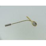 Tennis Interest; An 18ct yellow gold Tie Pin, the finial in the form of a tennis racket with diamond