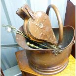A late 19thC/early 20thC copper Coal Scuttle, together with copper bellows, fire pokers, fire tongs,