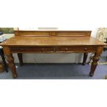 A William IV oak Serving Table, stamped Maple & Co., the rectangular top with raised back, above tw