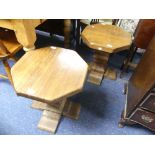 A pair of oak ecclesiastical octagonal Side Tables, on a pedestal base, 18in (46cm) wide x 18in (