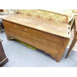 An antique provincial Chest, the hinged four-plank with cleated ends, on stile supports, in