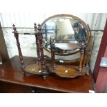 An oval oak swing Dressing Table Mirror, 23in (58.5cm) wide, one finial repaired, together with a