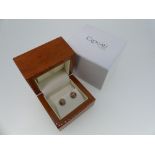 Clogau Gold; A pair of 9ct yellow and rose gold Ear Studs, of circular form in yellow gold, with