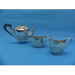 A Victorian silver three piece Tea Set, by Barker Brothers, hallmarked Birmingham, 1895, of oval