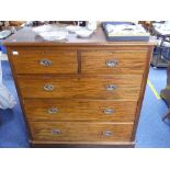 A Victorian mahogany Chest of Drawers, the rectangular top with rounded edge and corners above two